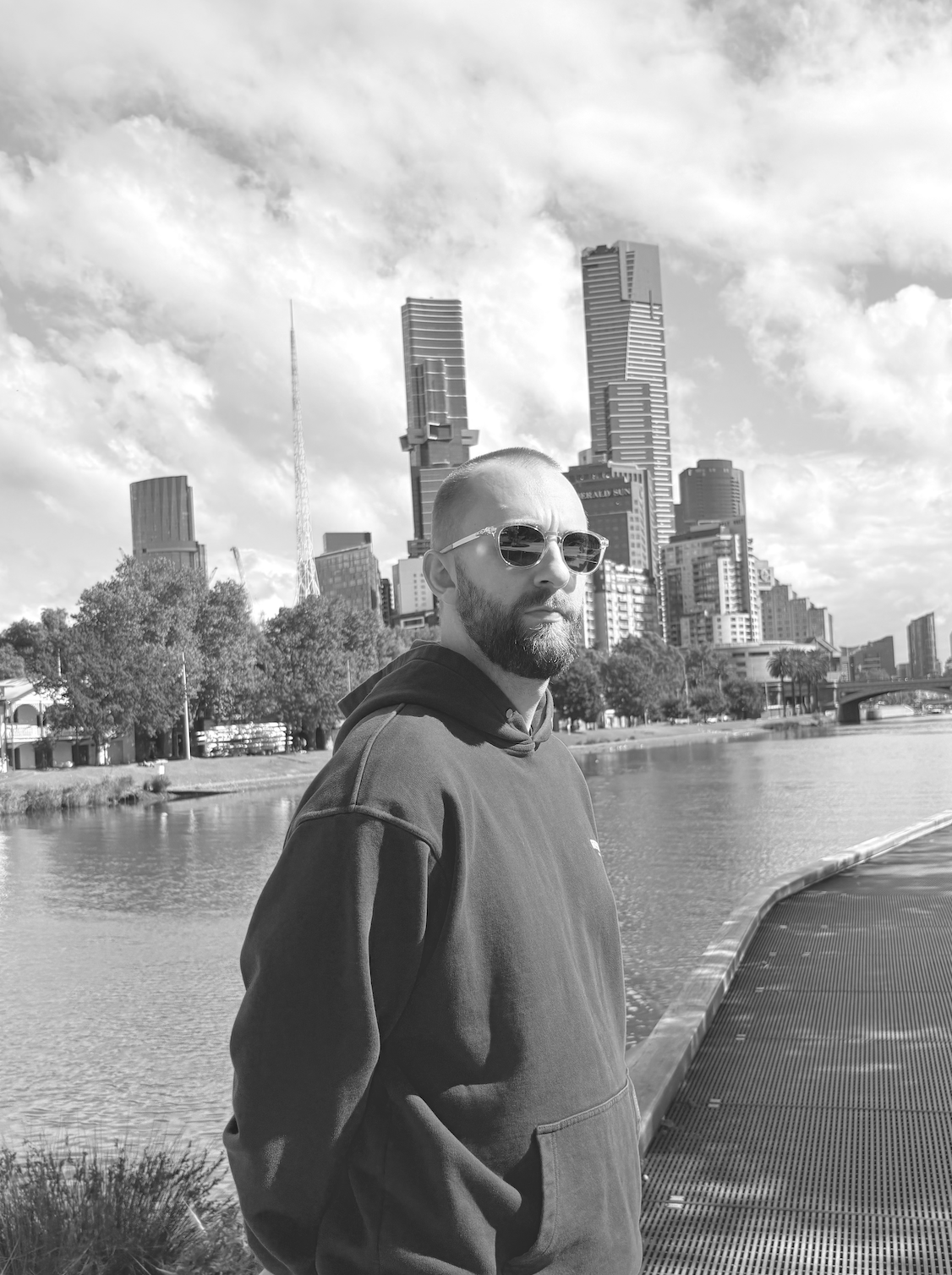 Miles, founder of BecomeProductised, on a riverside walkway in Melbourne